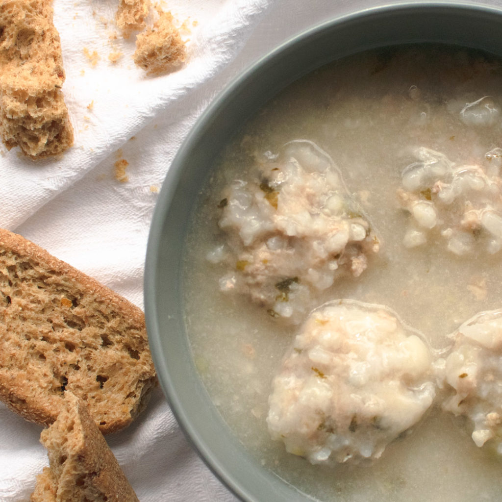 RiceMeatball Soup in grey bowl with rye rusks